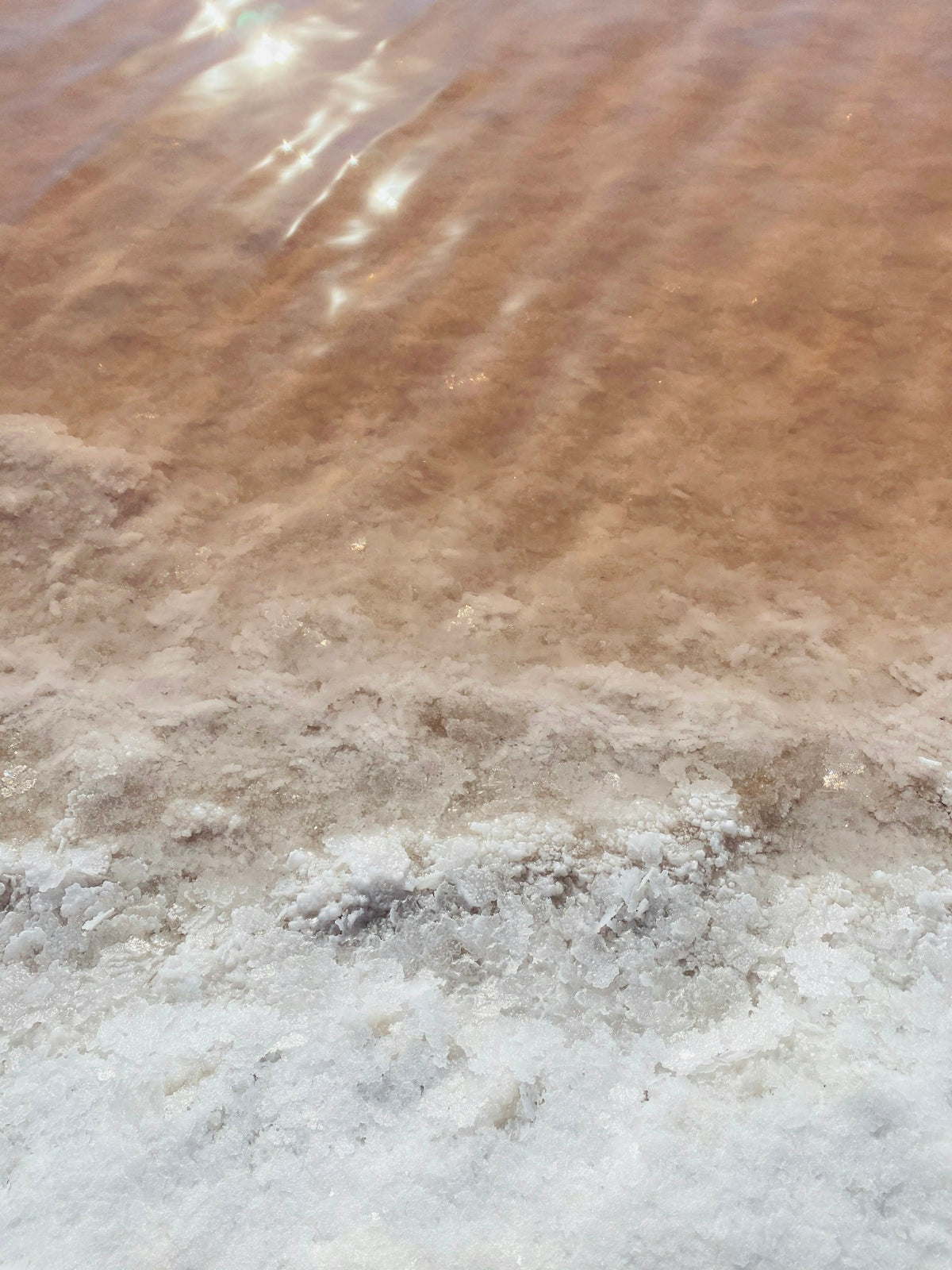 water waves on brown sand