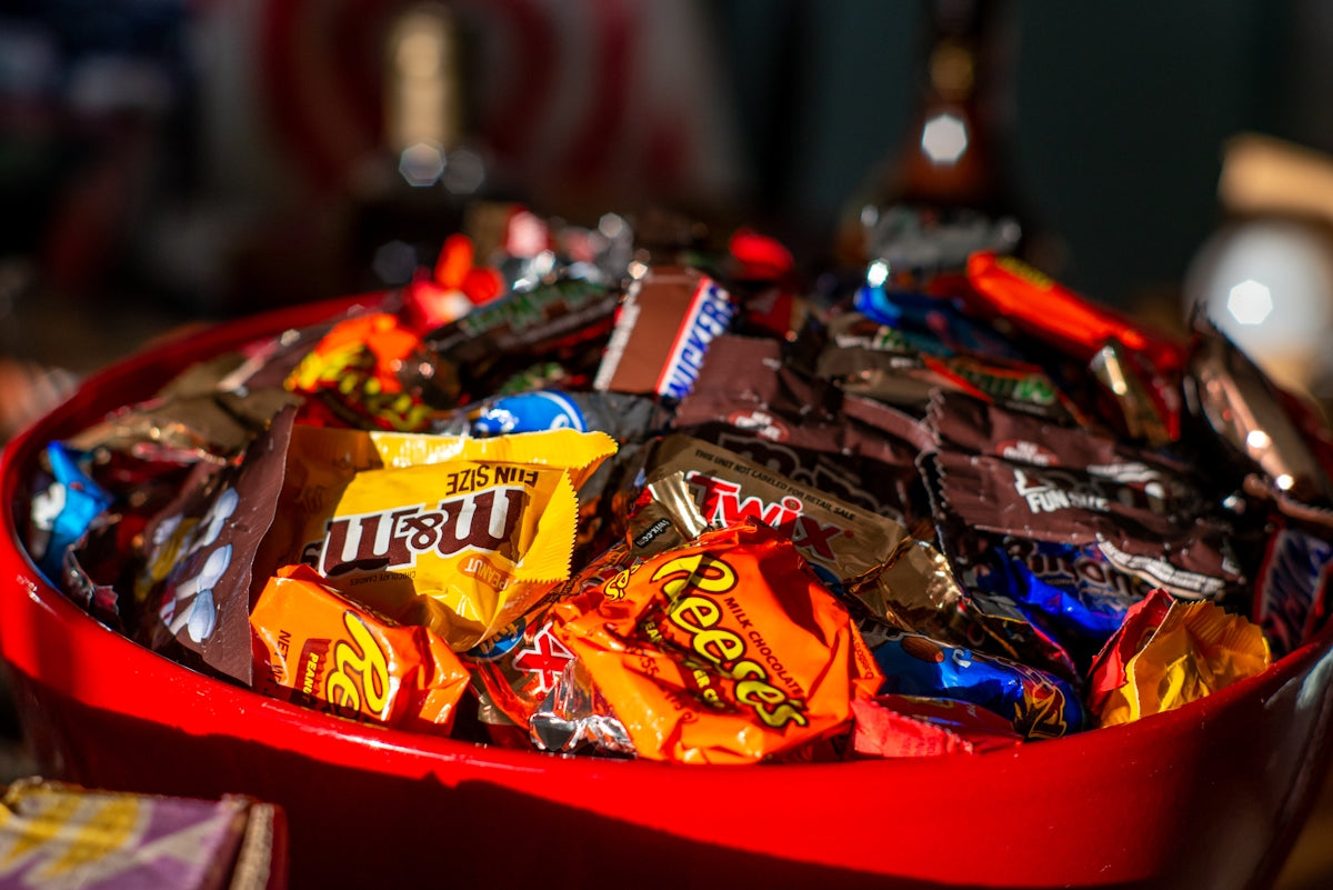 a red bowl filled with lots of candy