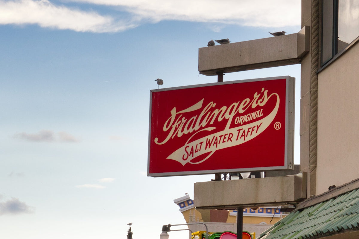 Fralinger's salt water taffy sign against sky