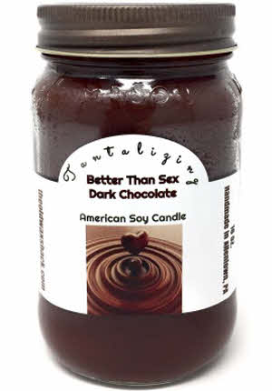 A dark brown soy candle in a 16 oz. mason jar with a label that reads 'Better Than Sex Dark Chocolate American Soy Candle'.