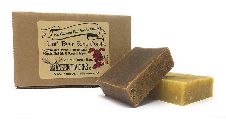 Two bars of handmade soap with packaging that reads 'All Natural Handmade Soap Craft Beer Soap Combo Hoppin Mad Ale & Pumpkin Lager'.