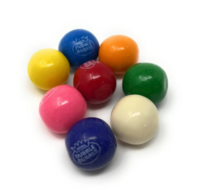 A group of colorful round dubble bubble gumballs arranged on a plain white background. The candies are in yellow, blue, orange, green, red, pink, and cream, with two of them showing the 'Dubble Bubble' brand logo.