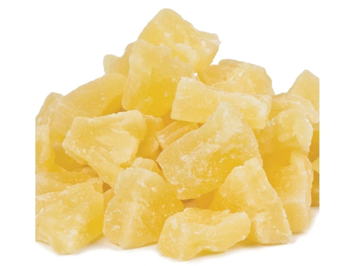 Dried pineapple chunks on a white background