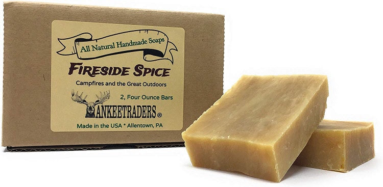 Packaging and two bars of Fireside Spice handmade goat milk soap with a beige color, labeled with the brand and product information.