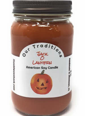 A 16 oz. soy candle in a mason jar with an orange color wax, labeled 'Jack O Lantern' and depicting a pumpkin face on the label.