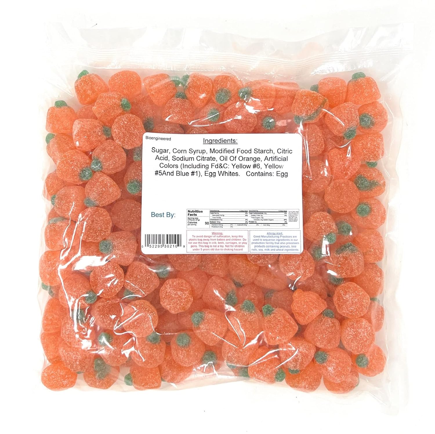 Bag of orange jelly pumpkins with a nutrition label on a white background
