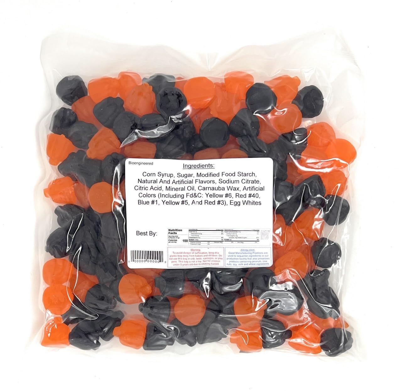 Bag of black and orange ju ju pumpkins with a label on a white background