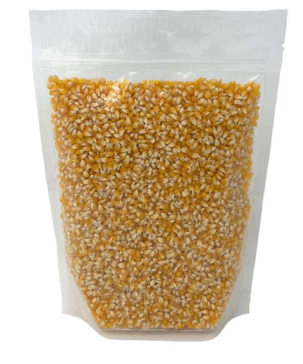 Bag of ladyfingers popcorn kernels on a white background