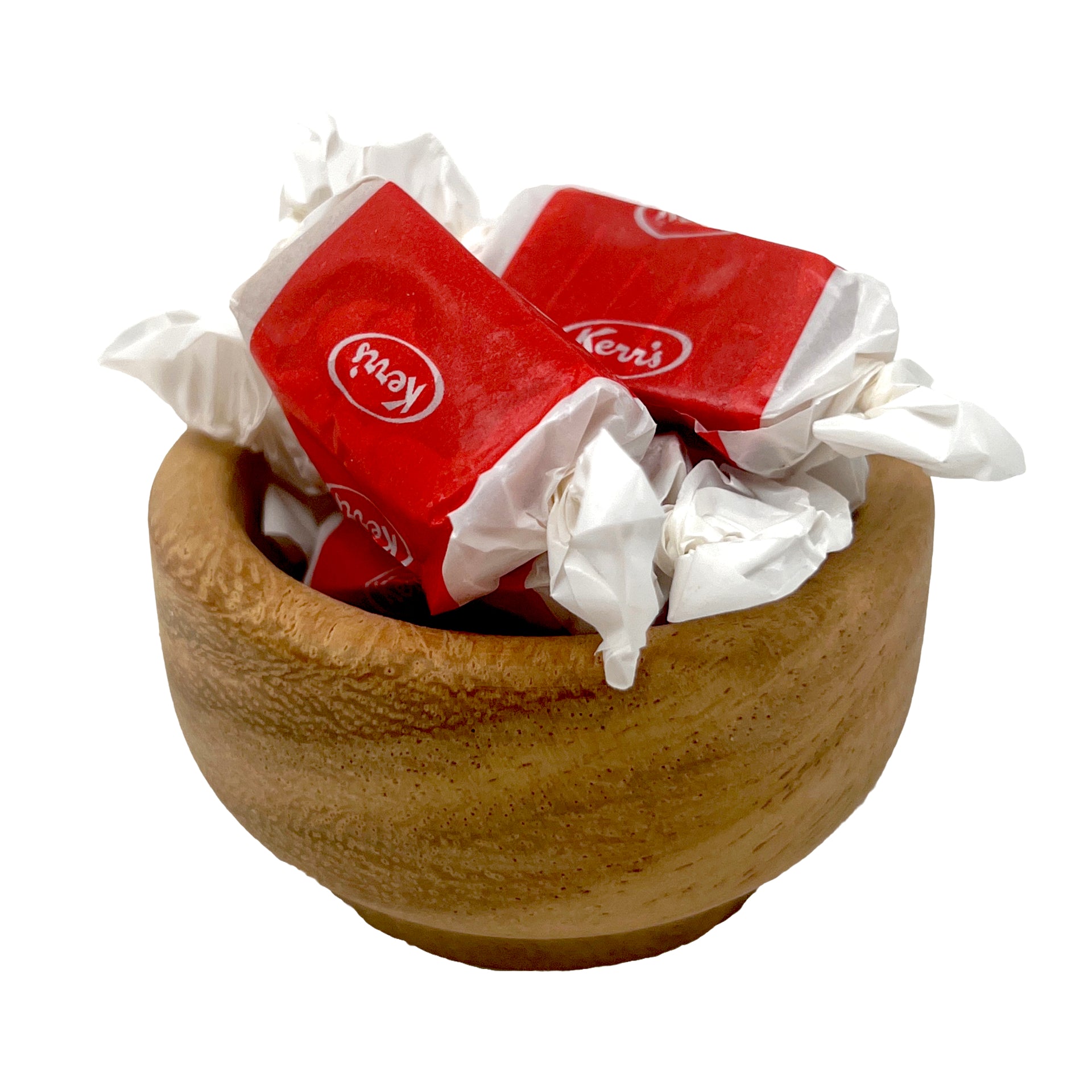 Wooden bowl filled with red and white wrapped maple kisses taffy candies on a white background