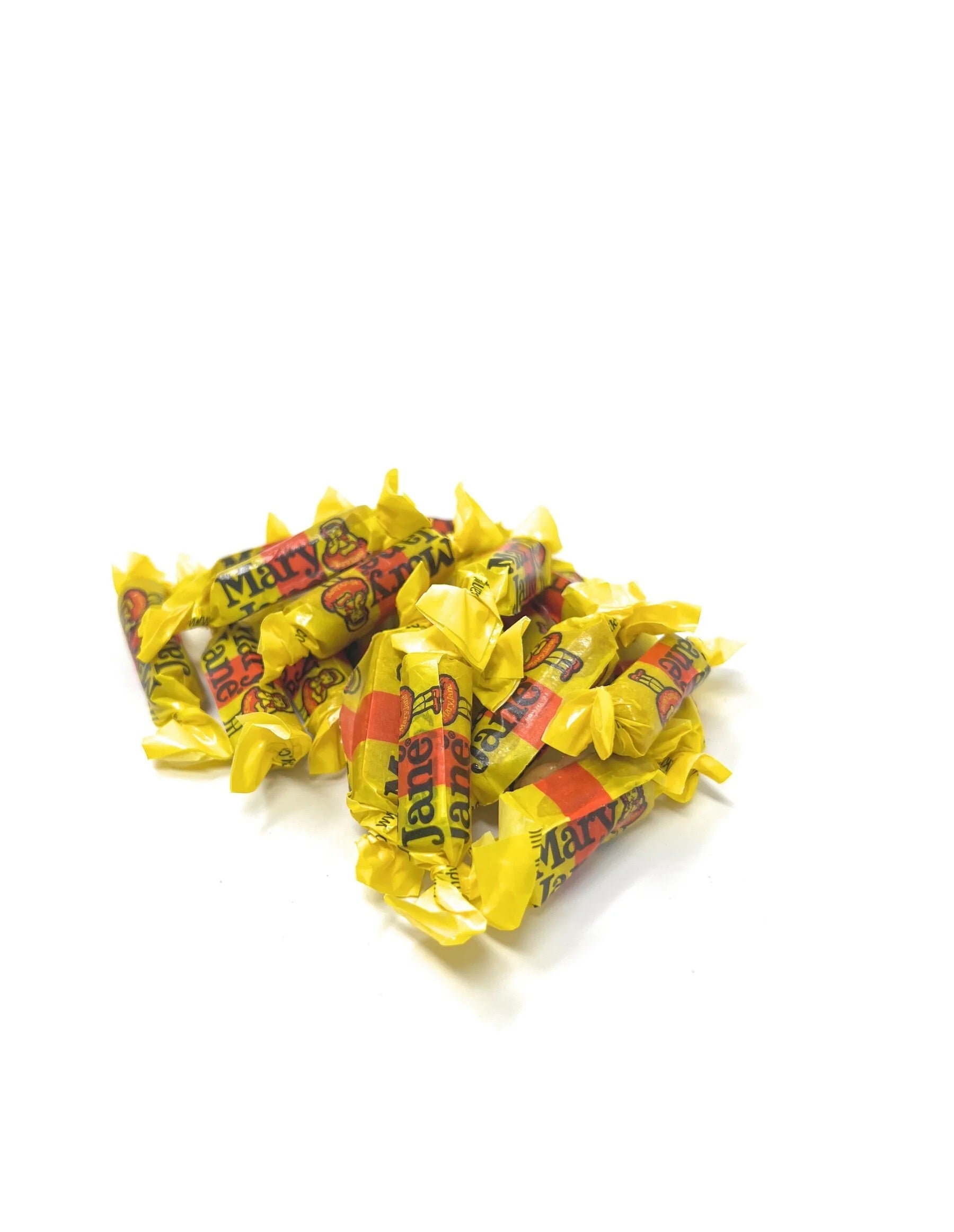 Pile of Mary Jane Mini candy in yellow and red candy wraps on a white background
