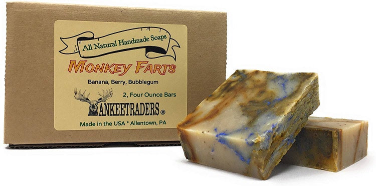 Two bars of Monkey Farts handmade soap with packaging that reads 'All Natural Handmade Soap, Banana, Berry, Bubblegum'. The soap has a beige and multicolored appearance with swirls of blue and pink.