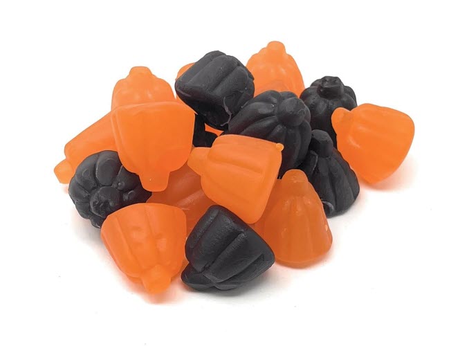 A pile of orange and black Ju Ju pumpkin-shaped gummy candies.