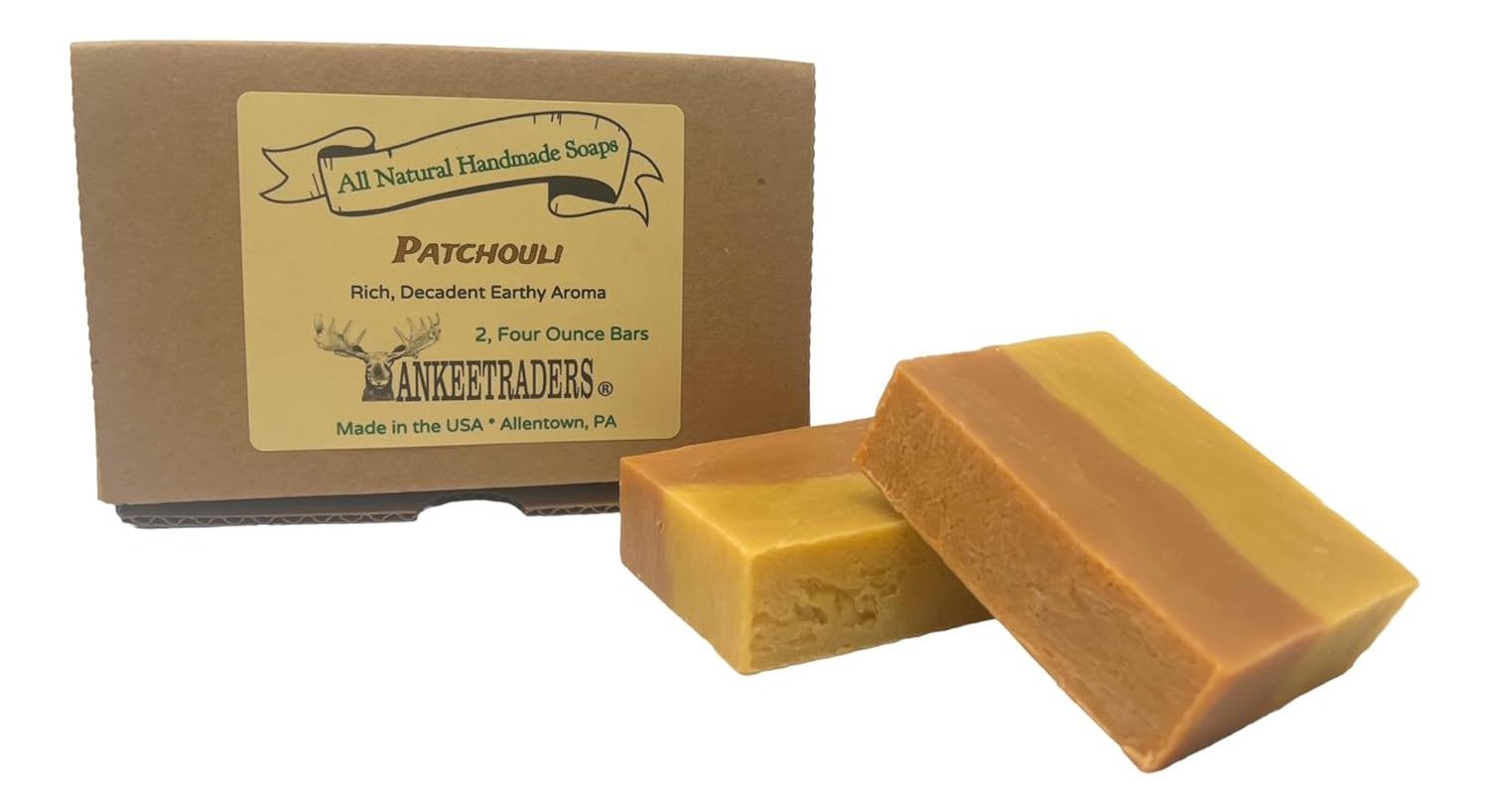Two bars of patchouli soap in front of a cardboard box labeled 'YANKEETRADERS' on a white background.