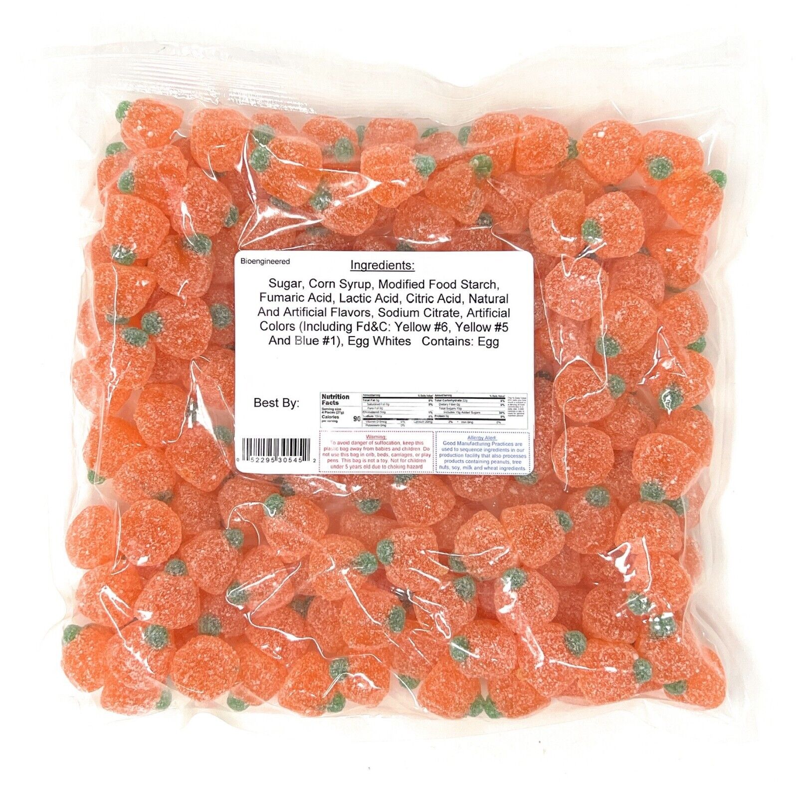 Bag of sour orange jelly pumpkins with a label on a white background