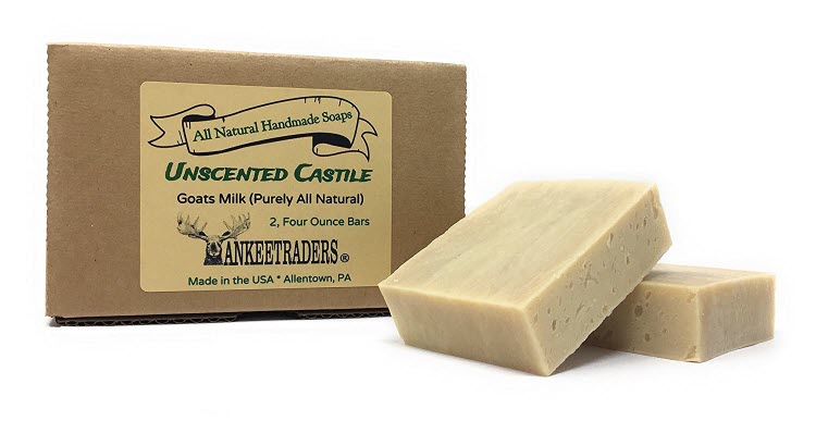 Two bars of unscented castile soap with goats milk, packaged in a brown box with a label that reads 'All Natural Handmade Soap, Unscented Castile, Goats Milk, Pure & Mild.'.